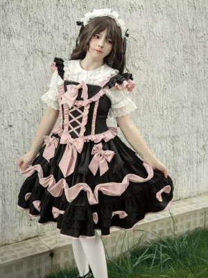 Gothic Lolita jumper dress with lace-up corset bodice and tiered ruffles front view on model