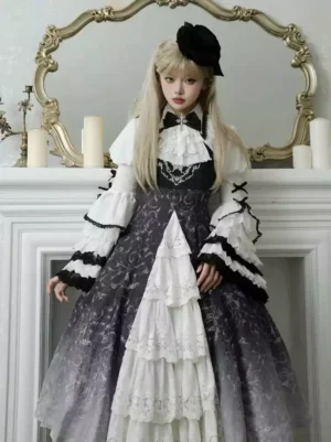 Full front view of Victorian-inspired Gothic Lolita dress with tiered lace panels, bow necktie, and gradient black-to-white fabric design, model with black hair bow in vintage interior setting