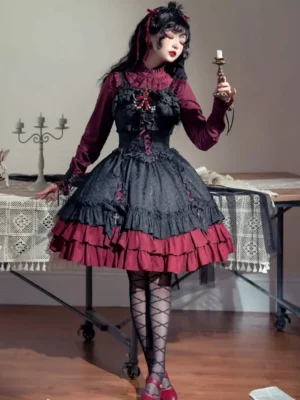 Gothic Lolita dress lace-up front closure detail, tiered ruffled wine red skirt hem, fishnet stockings, three-quarter side-back studio view