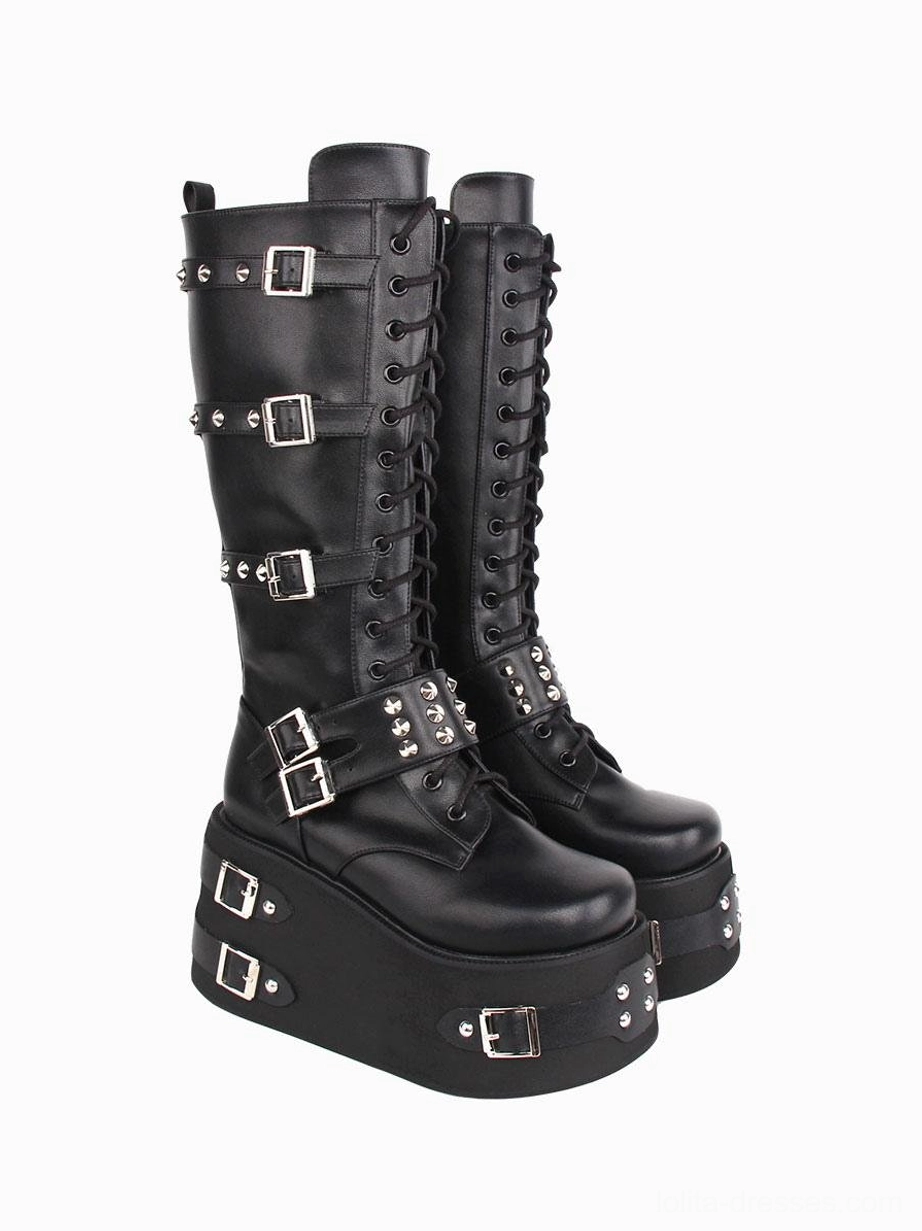 Gothic lolita knee-high platform boots paired side three-quarter view showing heel sole silver buckles mid-calf shaft