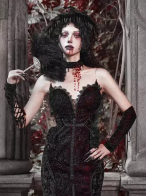 Female model wearing gothic lolita black lace arm covers with blood-drop choker and dark gothic makeup, vintage stone column outdoor setting showcasing complete gothic ensemble styling