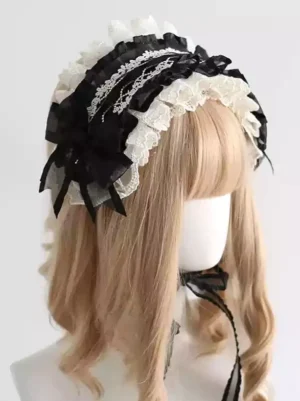 Gothic lolita black lace headband with decorative bows and off-white ruffled trim shown on mannequin with blonde wig, left three-quarter view showcasing tiered lace layers and bow details
