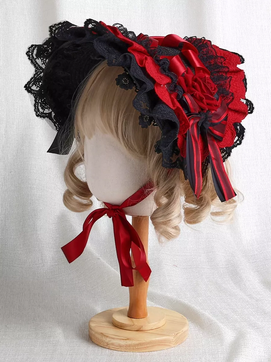 Gothic Lolita lace-up bonnet left side view featuring red-black two-tone design with delicate lace trim and ribbon decorations on blonde-haired mannequin