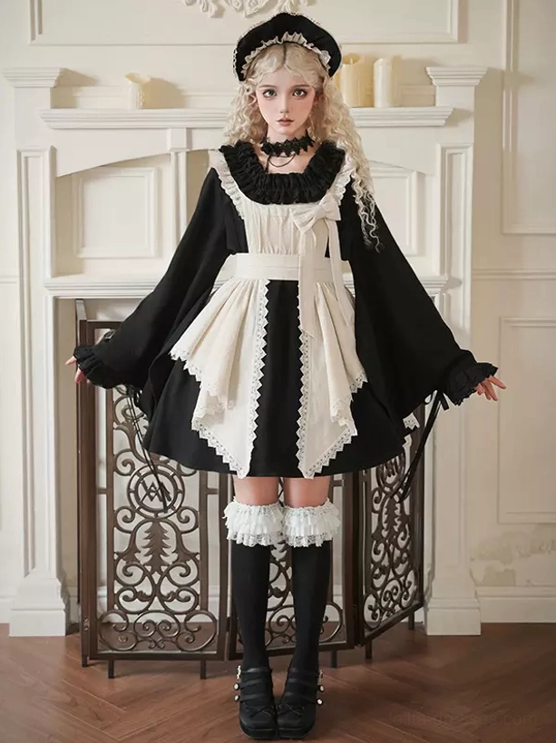 Black and cream Gothic Lolita maid dress with color blocking, wide bell sleeves, lace trims, and cream front bow on blonde model in vintage indoor setting