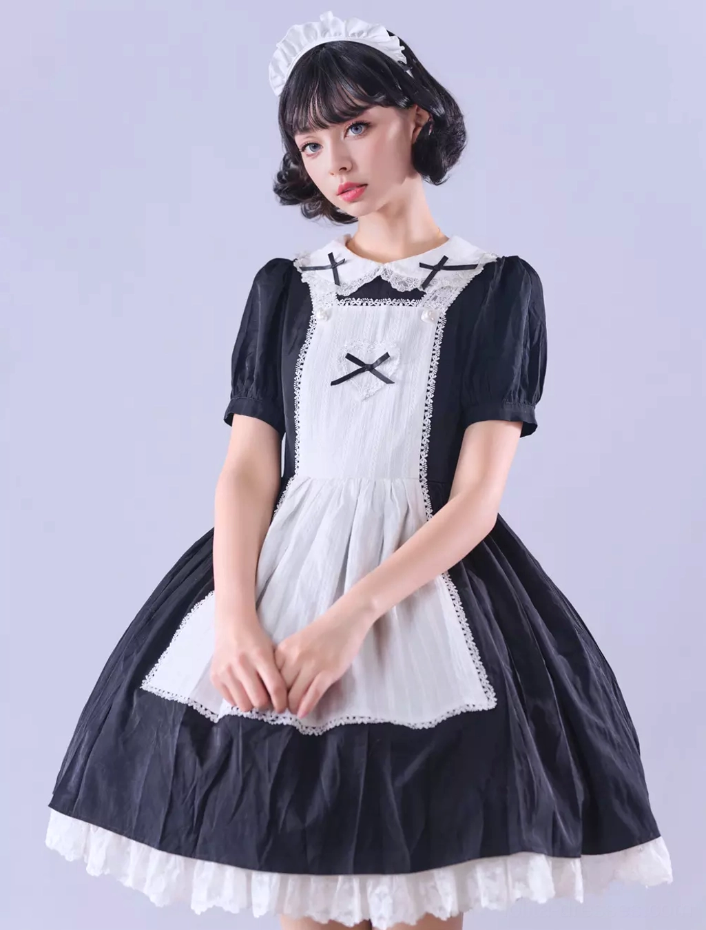 Gothic Lolita maid dress bodice and upper torso detail, short puffed sleeves construction, bow embellishments, lace trim around neckline and armholes