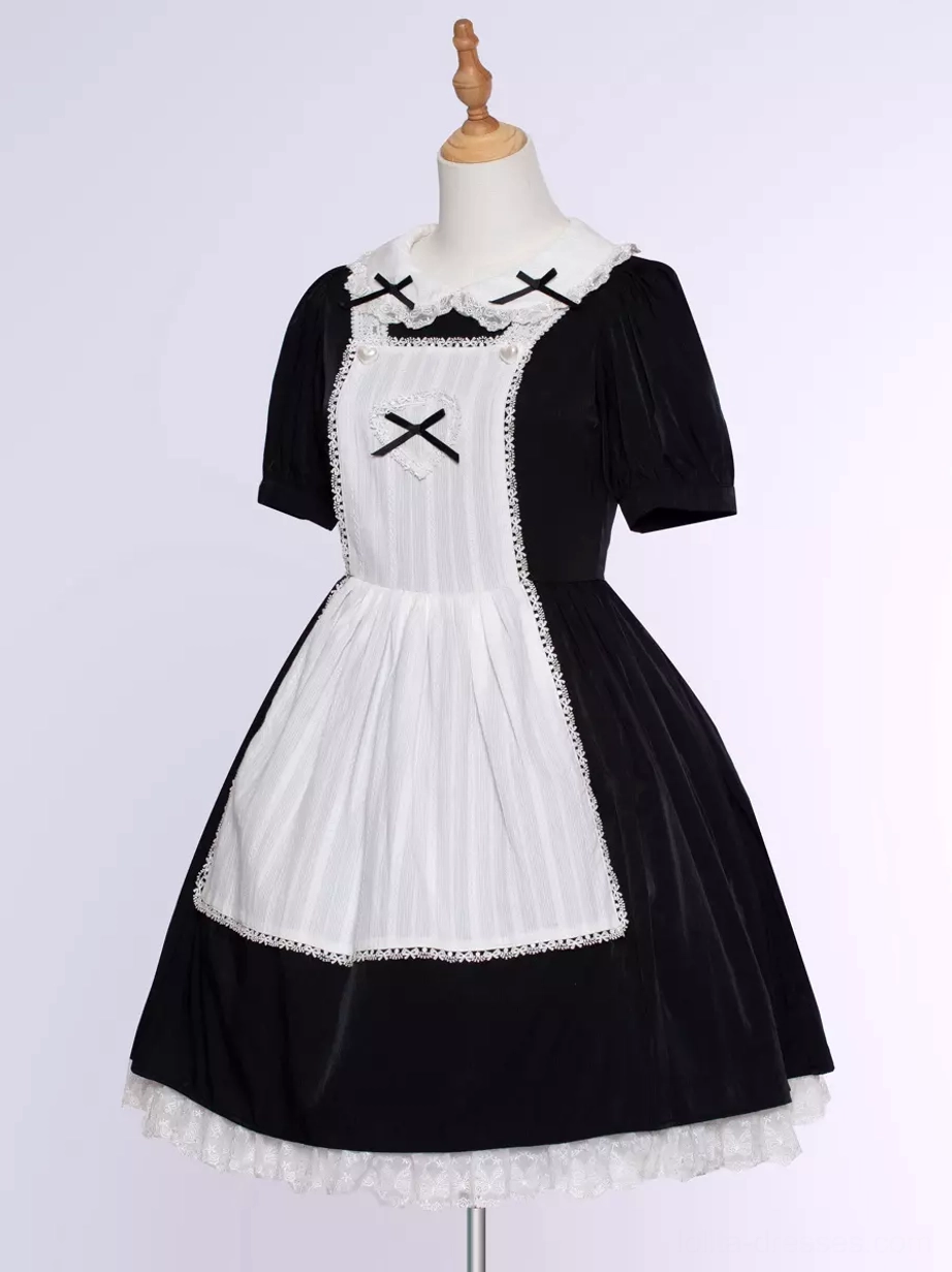 Gothic Lolita black maid dress detail shot showing lace ruffle construction, short sleeve puffing, embellishment placement, textile quality showcase