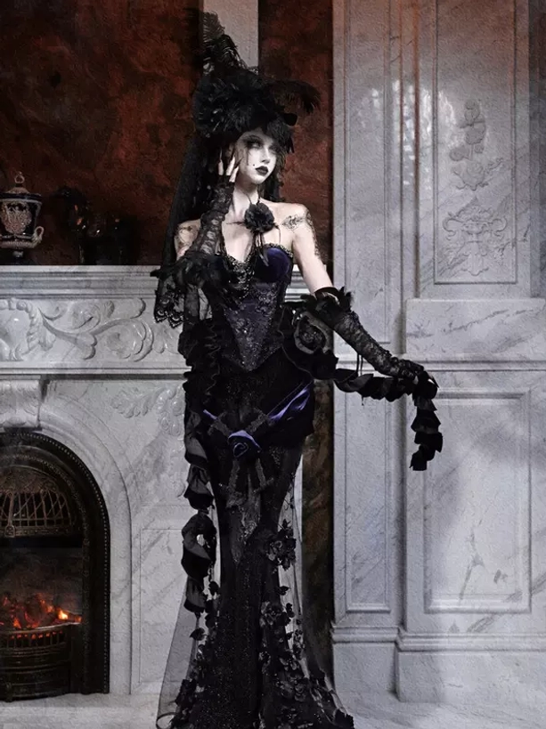 Gothic lolita mermaid corset dress with floor-length skirt and floral lace appliques - full-length front view with fireplace background