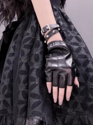 Gothic lolita riveted arm cuffs double rivet wristbands styled with black lolita skirt overhead flat lay view
