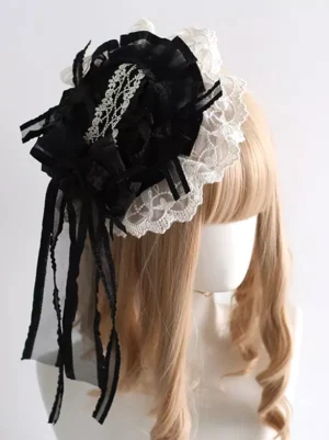 Gothic lolita mini hat with white lace web decoration and ruffled black fabric, long black ribbon tassels hanging elegantly, shown from front right angle on blonde mannequin, perfect for lolita fashion coordinates