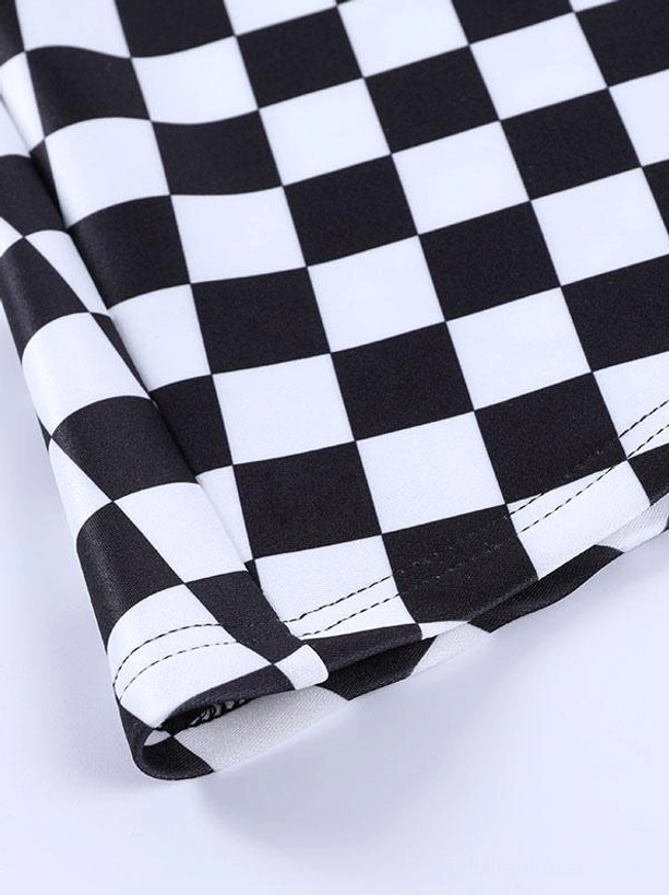 Close-up detail of checkerboard fabric edge and seam stitching on gothic lolita mini skirt, showing precise stitching and pattern alignment