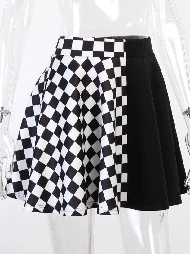 Black gothic lolita mini skirt on mannequin displaying high-waist design, checkerboard and solid black fabric splicing, full front view on white background