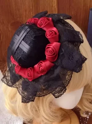 Side rear wearing view of Gothic Lolita headdress featuring wine red rose wreath, black lace trim, and satin cross strap on blonde doll mannequin for tea party styling