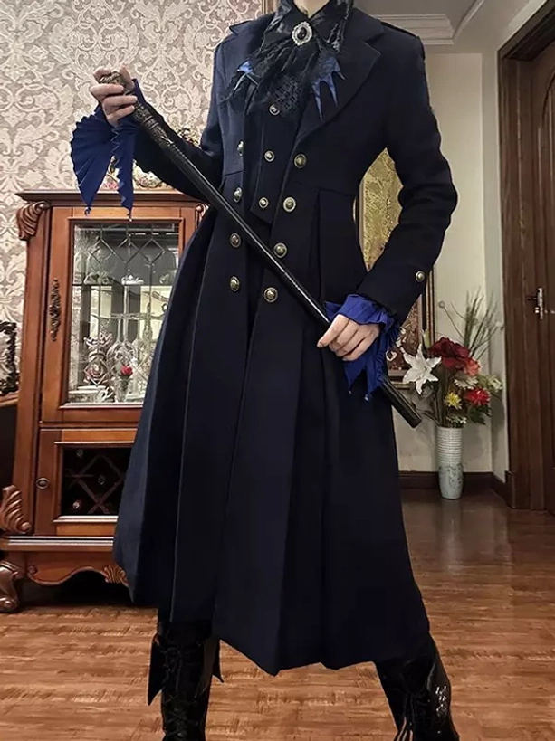 Gothic lolita navy overcoat with double-breasted metal buttons and royal blue ruffled cuffs front three-quarter view