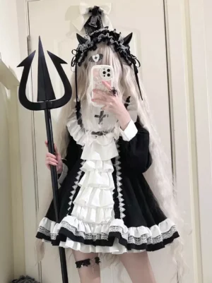 Gothic Lolita nun dress close-up front mirror selfie detailed view of devil horn lace headwear and layered ruffled front skirt black and white design