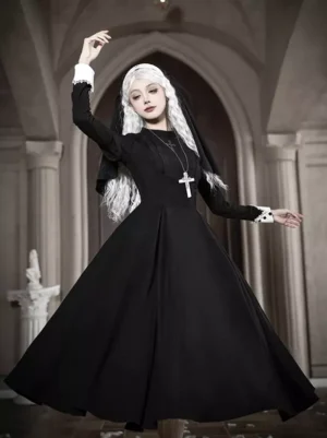 Three-quarter view of long-sleeve black nun gothic lolita dress with white lace cuffs and cross necklace in church archway
