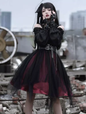 Gothic Lolita one-piece dress with puffed long sleeves and chain decorative waist belt, front standing view at industrial ruins location