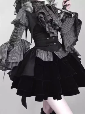 Close-up detail of Gothic Lolita outfit upper and lower torso showing embellished striped ruffled collar blouse, fitted black waistcoat, and layered velvet mini skirt construction