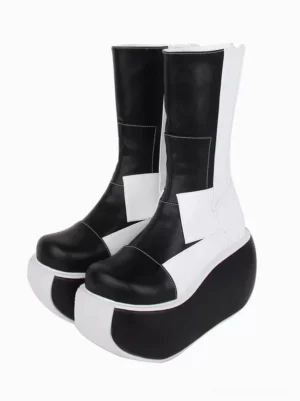 Monochrome patchwork gothic lolita platform boots front three-quarter view showcasing black and white color-block design with thick split-tone platform sole and architectural topstitching details
