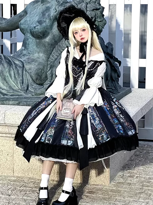 Gothic Lolita dress sitting view showcasing off-shoulder bell sleeves chiffon overlay pearl chain bust detail and full skirt silhouette