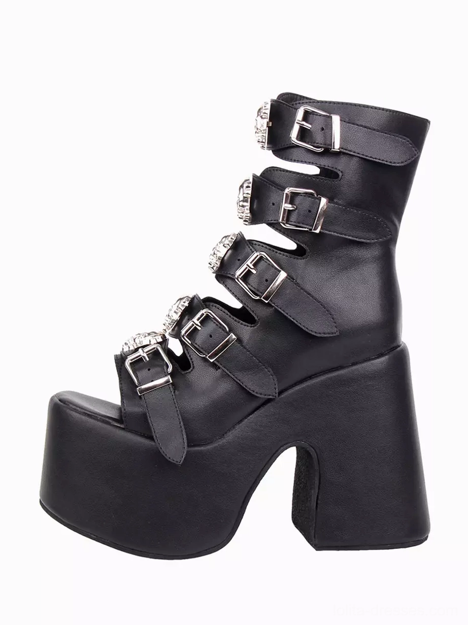 Single Gothic peep-toe platform boot side three-quarter view with silver skull and buckle decorations on straps