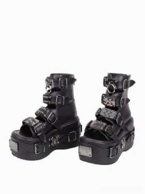 Side profile view of black gothic peep-toe platform sandals showing chunky wedge sole and buckle details