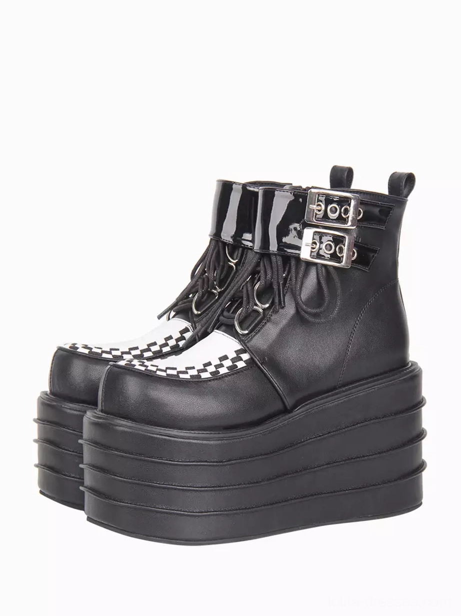 Gothic Lolita platform ankle boots front three-quarter view showing black PU leather with dual metal buckle straps and checkerboard toe cap detail