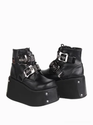 Black gothic platform ankle boots side profile showing dual metal buckles round toe and studded thick wedge platform sole