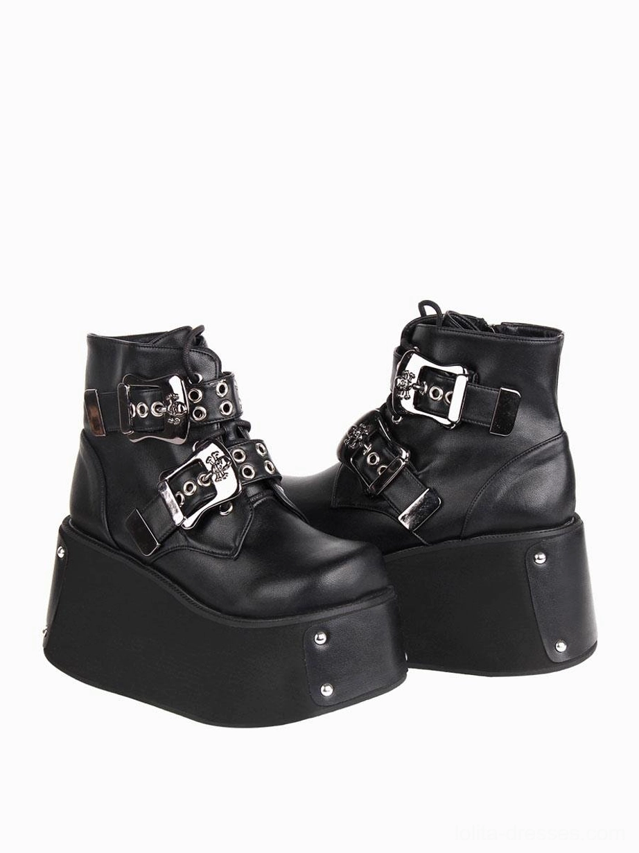 Black gothic platform ankle boots side profile showing dual metal buckles round toe and studded thick wedge platform sole