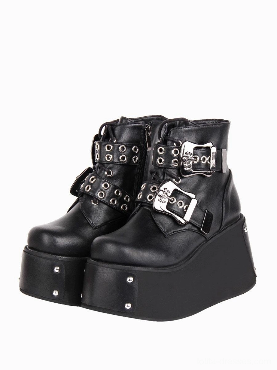 Gothic lolita black platform ankle boots with silver skull buckles and grommet lace straps front 3/4 view