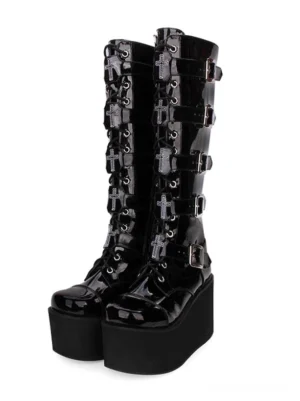 Black Gothic Lolita platform boots front paired display showing cross-adorned buckles patent leather finish and lace-up construction with metal grommets