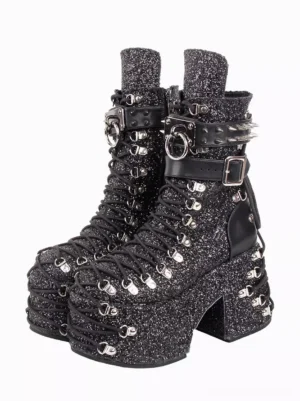 Gothic lolita platform boots with black glitter fabric and silver grommets, front oblique view showing chunky wedge heel and decorative hardware details