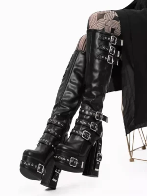 Black gothic lolita knee-high platform boots silver buckle straps side overhead sitting view chunky block heel argyle tights