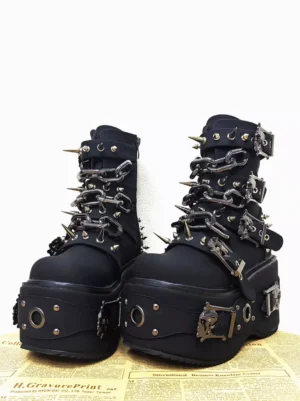 Black Gothic Lolita platform boots monogram suede front view metal spike grommets round toe skull buckles chains decorative hardware
