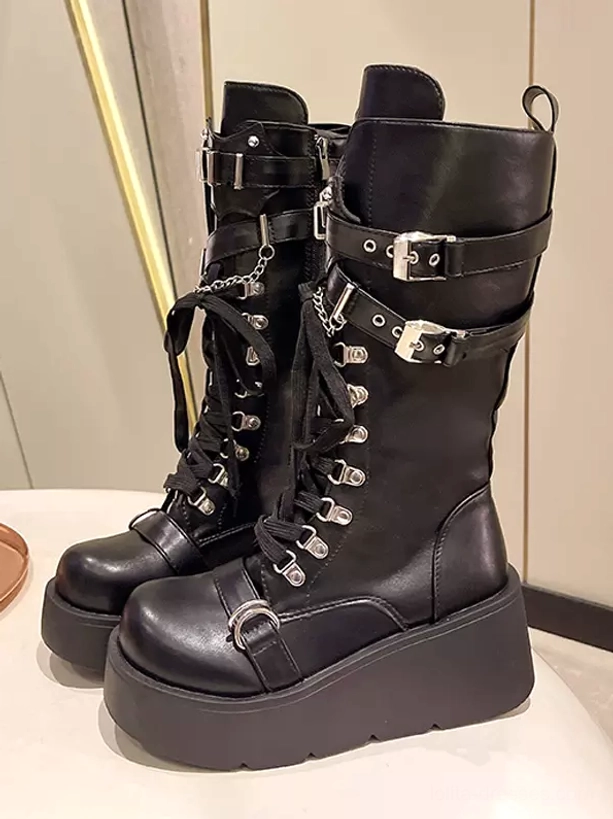 Front three-quarter display pair black gothic platform mid-calf boots metal buckle straps chains lace-up design thick rubber sole