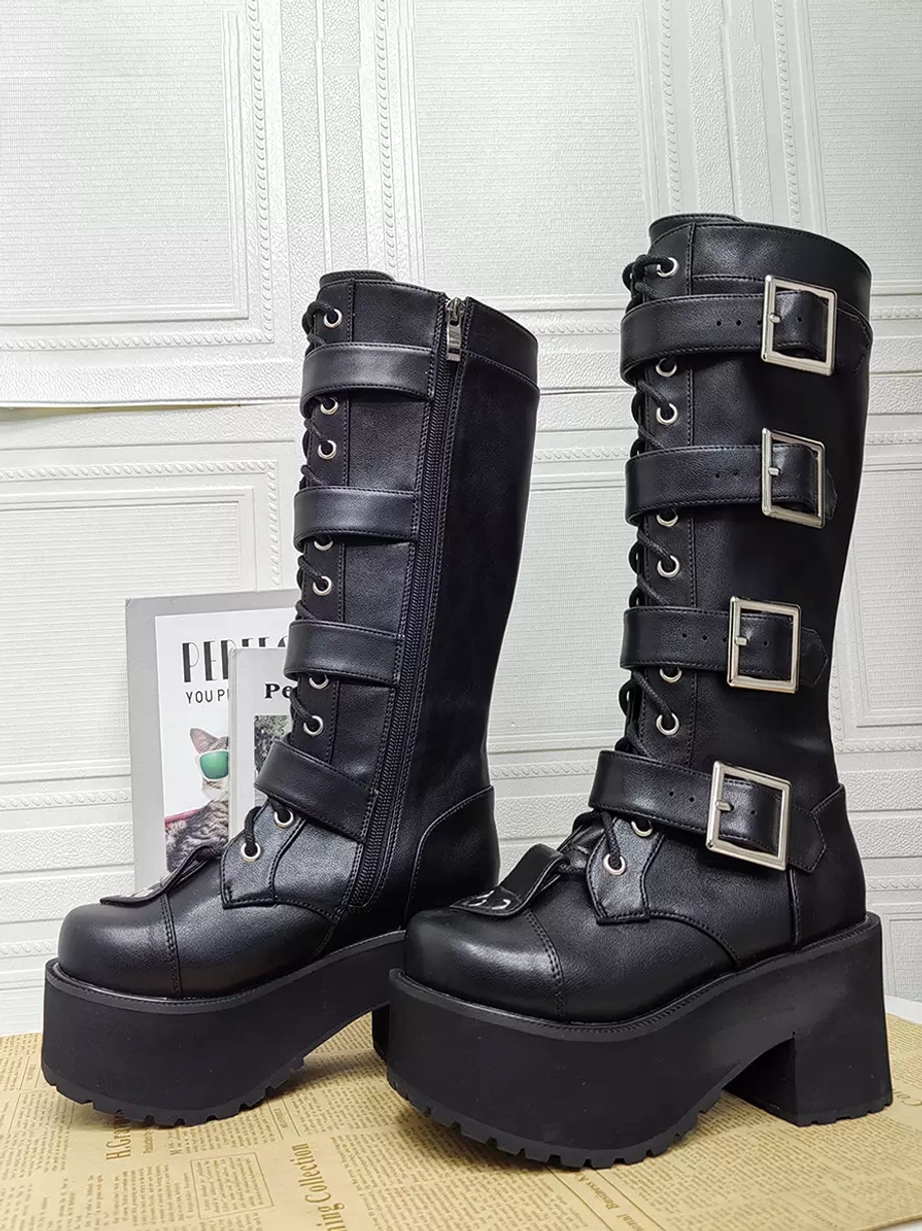 Pair of black Gothic Lolita boots front-side three-quarter view with round closed toe lace-up laces multiple silver buckles and chunky platform sole