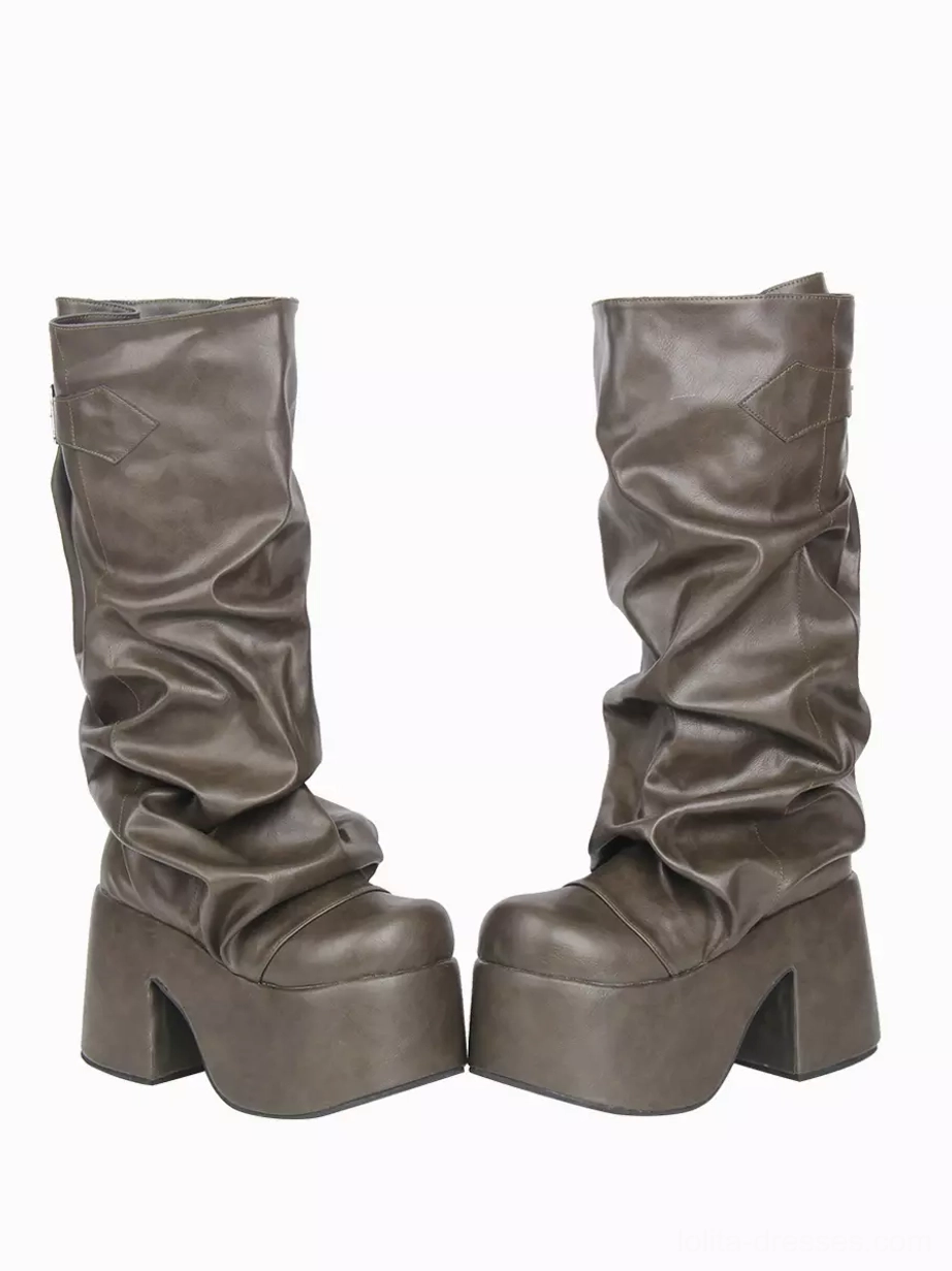 Pair of slouchy gothic lolita platform boots in hunter green PU leather, side-by-side flat lay showing both boots together, platform sole visible, matte PU finish, decorative buckle detail on white background