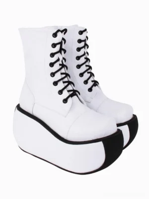 Pair of white Gothic Lolita platform boots oblique front angle showing metal eyelets black contrast lacing and structured mid-calf shaft height