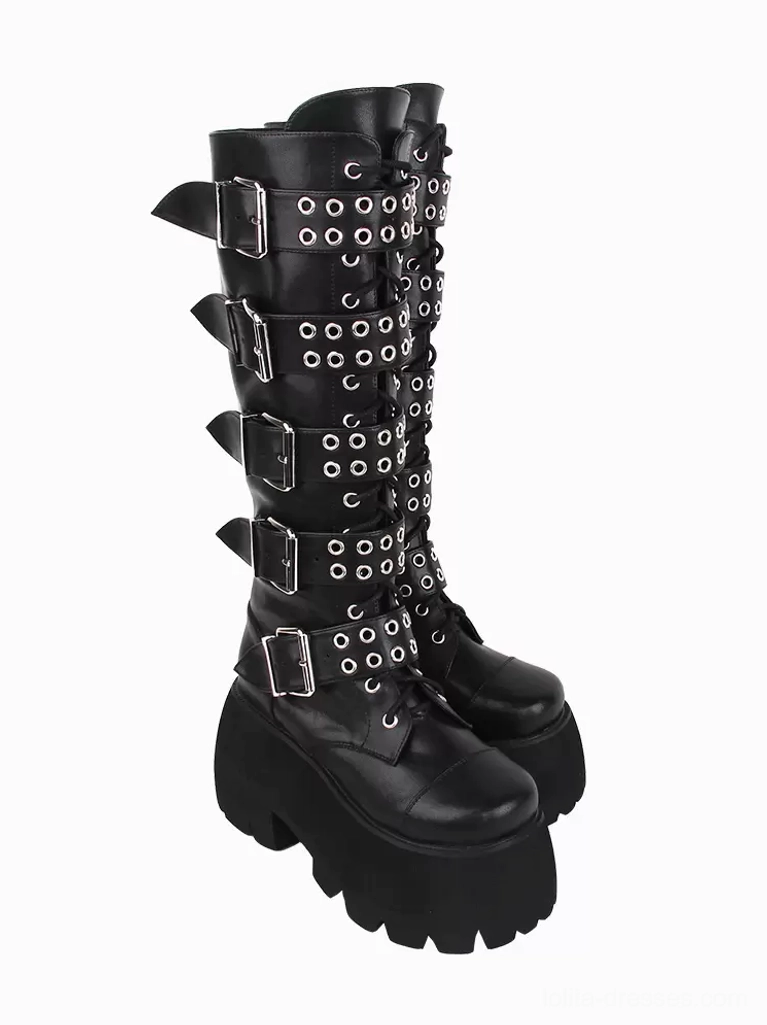 Front low-angle view of paired gothic lolita boots highlighting abundant grommet and buckle decorations, round toe design, and dramatic platform elevation