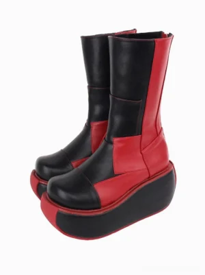Pair of black gothic lolita platform boots front three-quarter view displaying two-tone PU leather color-block design, chunky platform heel, and contrasting red sole trim detail