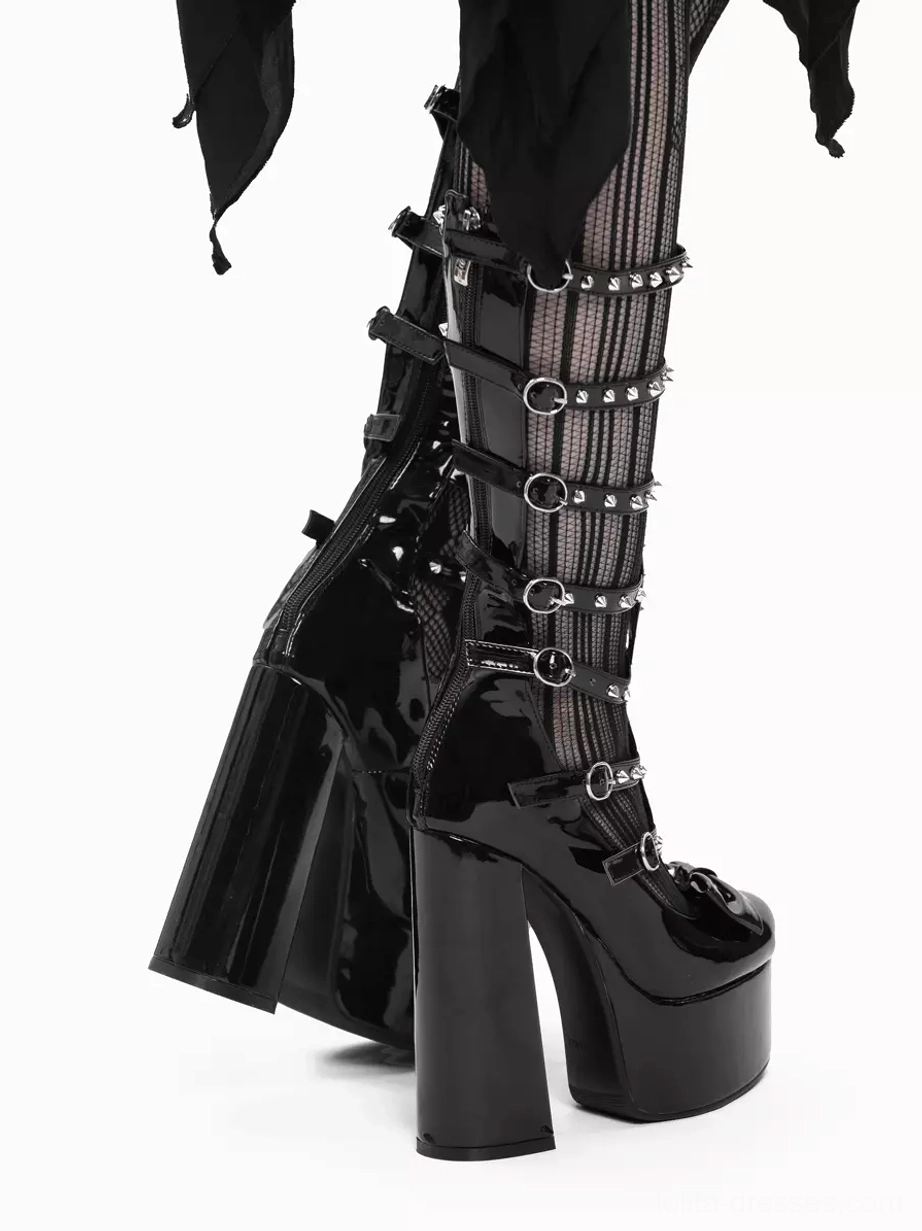 Side rear view of Gothic Lolita platform boots pair on white background showing patent leather construction, studded buckle straps, chunky block platform heel and overall silhouette