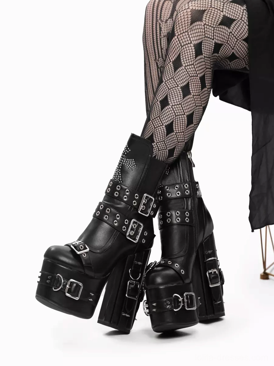 Low side profile view of gothic lolita platform boots on model, highlighting thick high block heel and metal buckle hardware detail