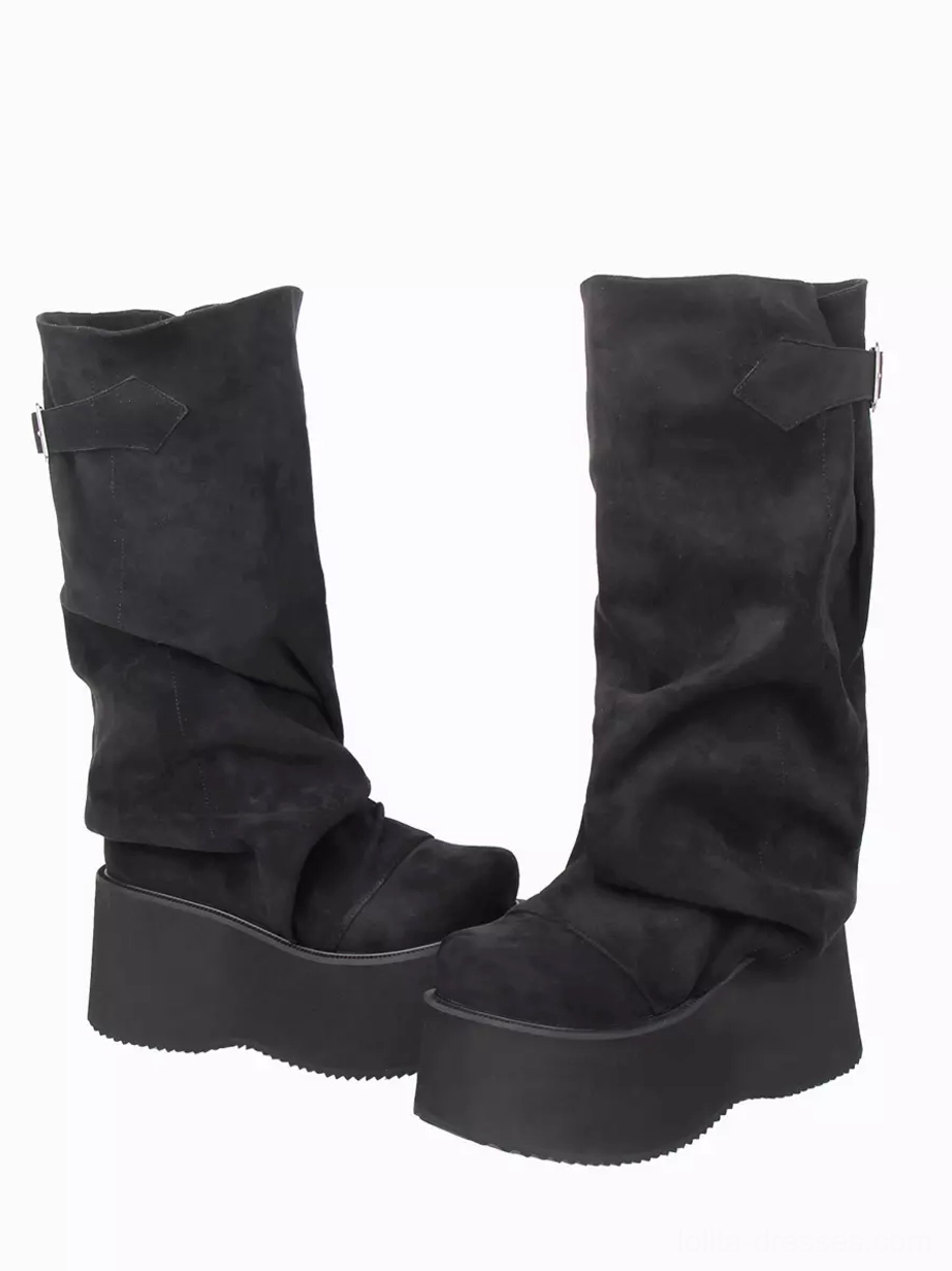 Black gothic lolita platform boots side oblique view displaying slouchy mid-calf shaft, rounded toe, matte corduroy finish, and adjustable side buckle detail