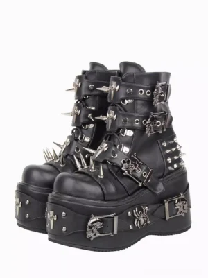 Gothic Lolita platform ankle boots front three-quarter view featuring black PU leather with silver spike studs and ornamental cross metal details on plain white background