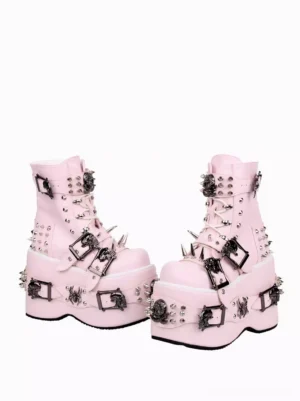 Side view of pair of pink punk style lolita wedge boots with multiple metal buckles and studs, demonstrating thick platform height and dramatic silhouette