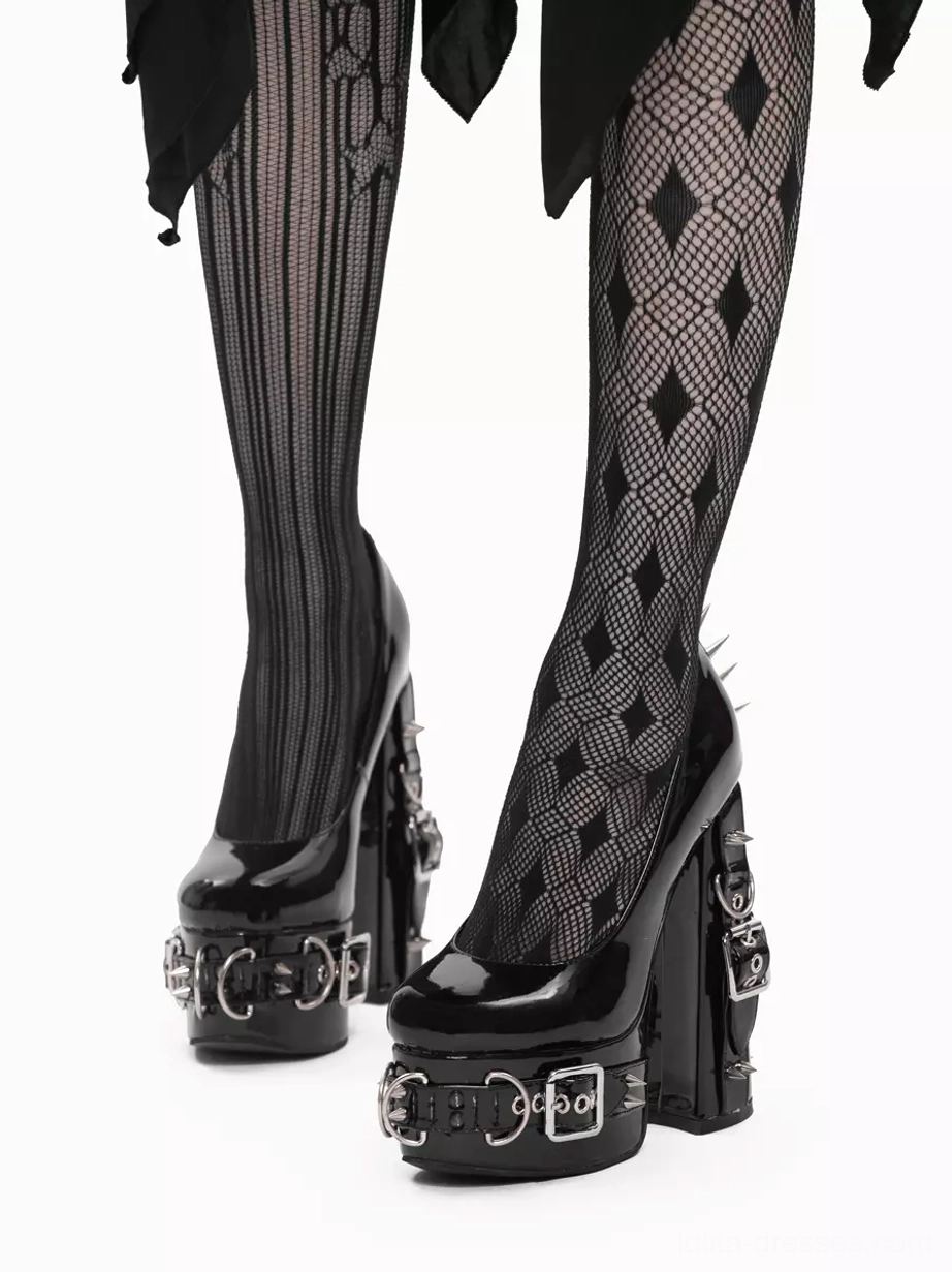 Gothic platform heels front-side low angle view model wearing patterned tights and gothic skirt with spiked heel