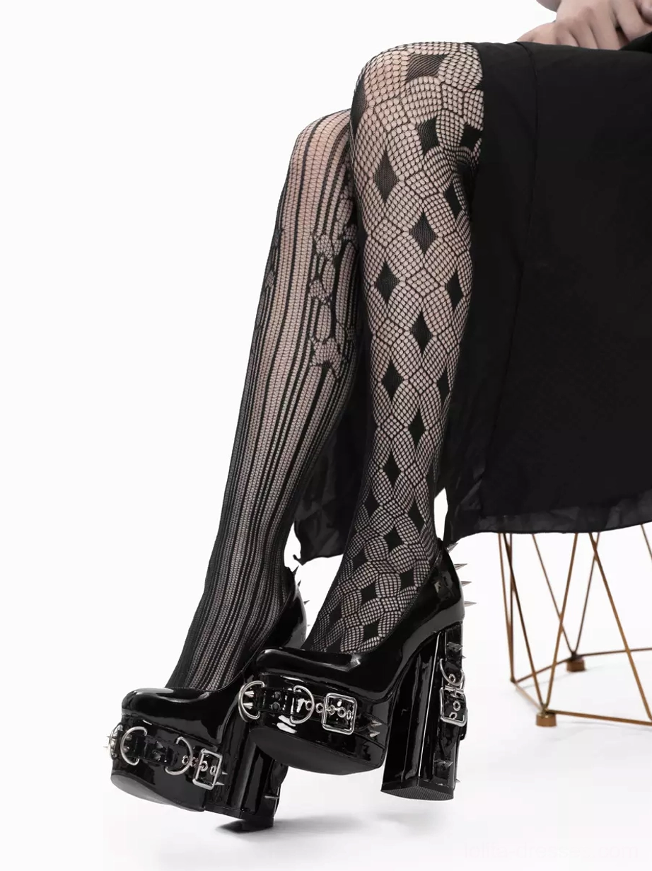 Gothic platform heels seated front view model on geometric chair wearing diamond net tights dual buckle straps