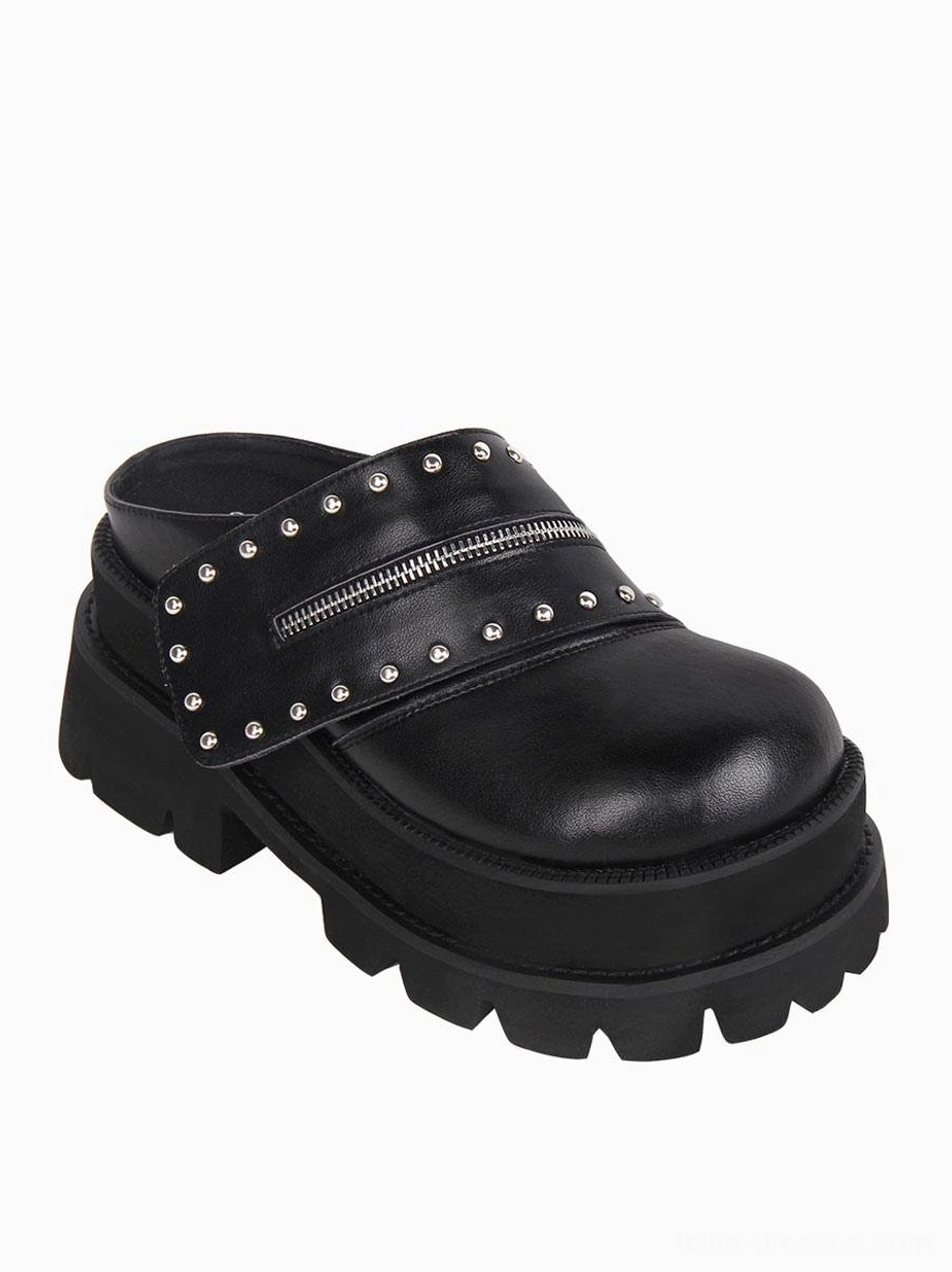 Single gothic Lolita platform mule sandal oblique view highlighting clear studded zipper strap detail, polished leather upper, and thick platform construction