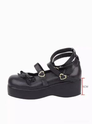 Single black gothic lolita wedge pump side profile view displaying 5cm wedge heel height double ankle straps ruffled bow embellishment heart buckle detail