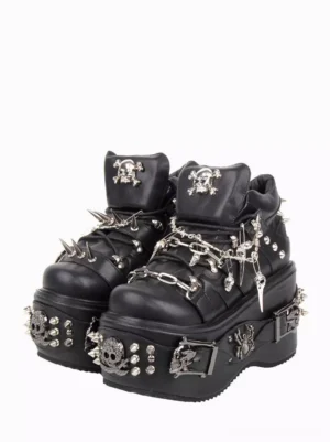Gothic Lolita platform pumps pair frontal view featuring black PU leather with metal skull studs spike chain details and thick chunky wedge platform sole