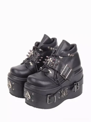 Black gothic lolita platform wedge pumps with metal studs and spider emblem front paired three-quarter view